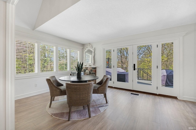 sunroom / solarium featuring french doors and visible vents
