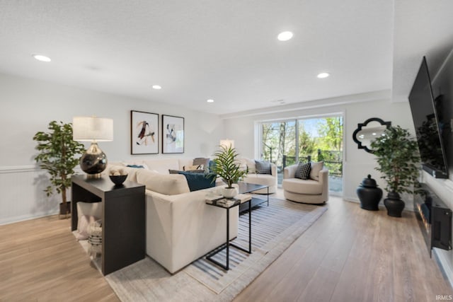 living room featuring recessed lighting and light wood-style floors