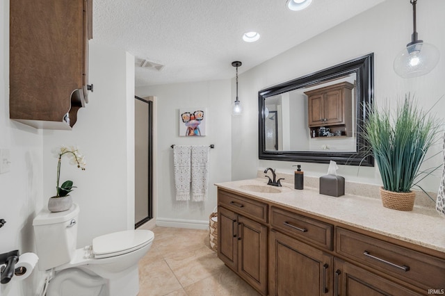 full bathroom with visible vents, a shower stall, vanity, tile patterned floors, and toilet