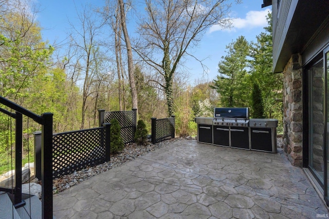 view of patio featuring exterior kitchen and area for grilling
