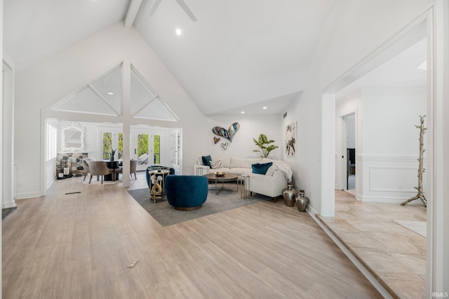 living room with high vaulted ceiling, light wood-style flooring, a ceiling fan, recessed lighting, and beamed ceiling