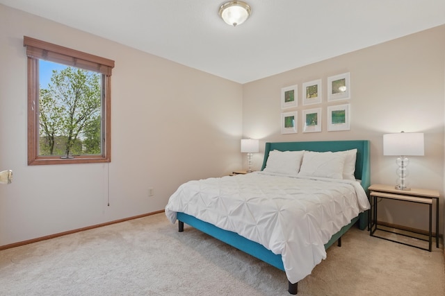 carpeted bedroom with baseboards