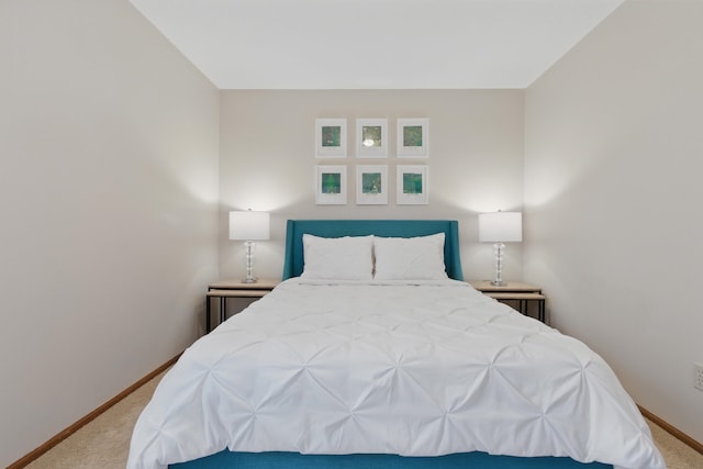 carpeted bedroom with baseboards
