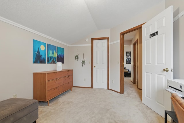 interior space featuring ornamental molding, light carpet, baseboards, a textured ceiling, and vaulted ceiling