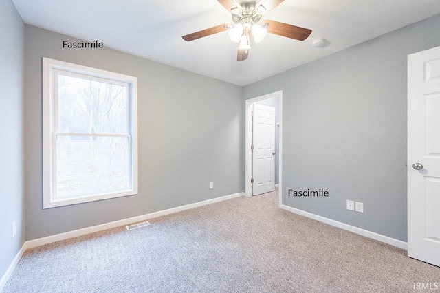 916 S Lantern Ln, Ellettsville, IN 47429 - spare room featuring light carpet, baseboards, a smoke detector, and ceiling fan