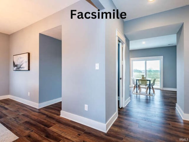 corridor with baseboards, recessed lighting, and dark wood finished floors
