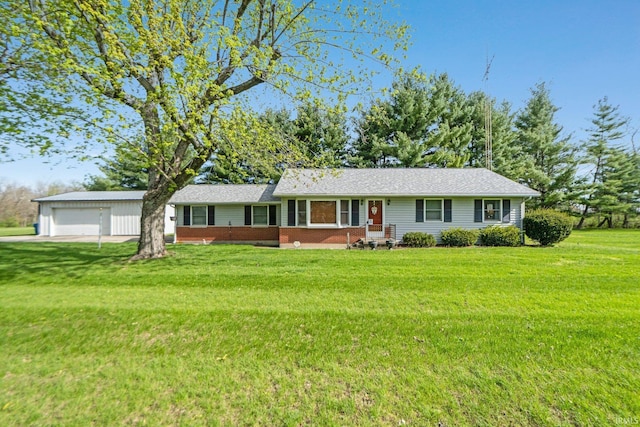 ranch-style home featuring a garage, a front lawn, and brick siding