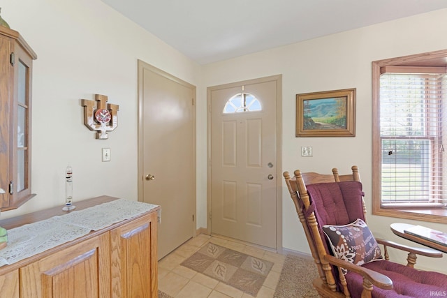 foyer entrance with light tile patterned floors