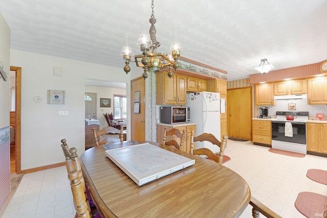 dining space featuring light floors, baseboards, and a notable chandelier