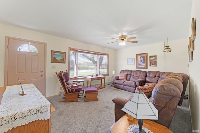 carpeted living area with baseboards, plenty of natural light, and a ceiling fan