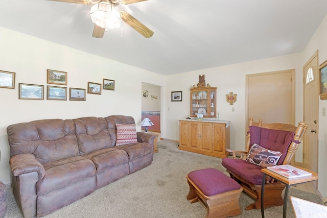 living room with light carpet and a ceiling fan