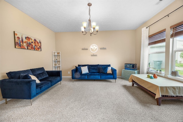 carpeted living room featuring an inviting chandelier and baseboards