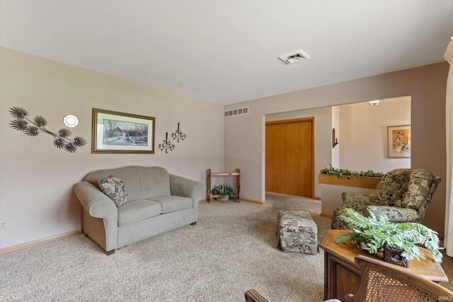 living room with carpet flooring, baseboards, and visible vents
