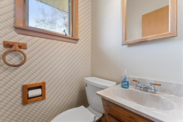 half bath with vanity and toilet