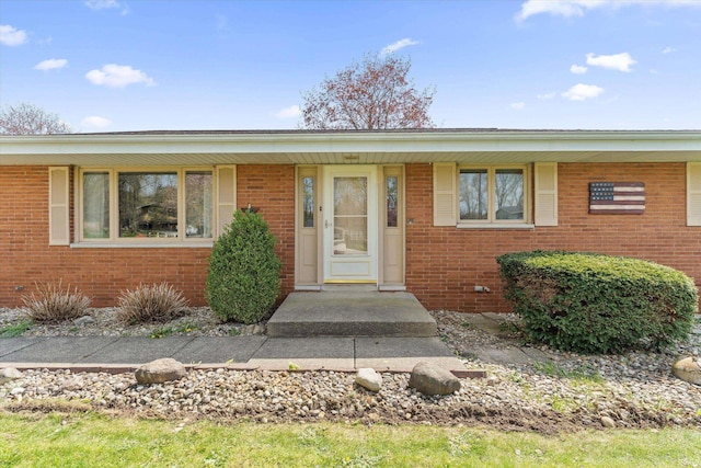 view of front of home with brick siding