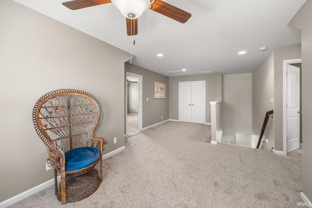unfurnished room featuring recessed lighting, baseboards, an upstairs landing, and carpet