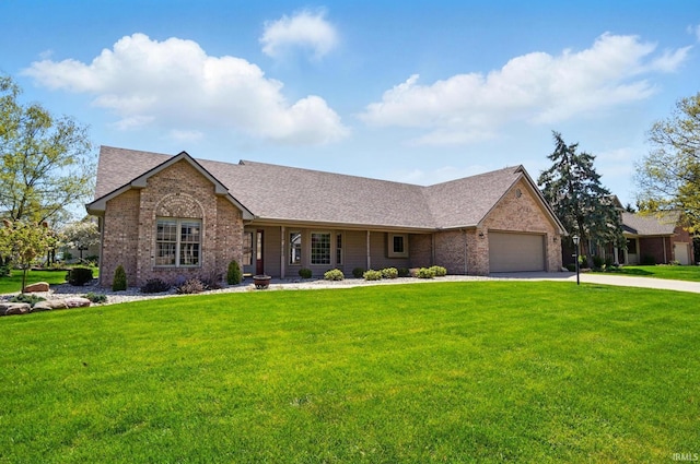 ranch-style home with driveway, a front lawn, and brick siding