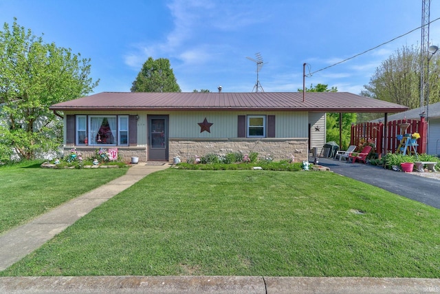 single story home featuring a front lawn, aphalt driveway, stone siding, and metal roof