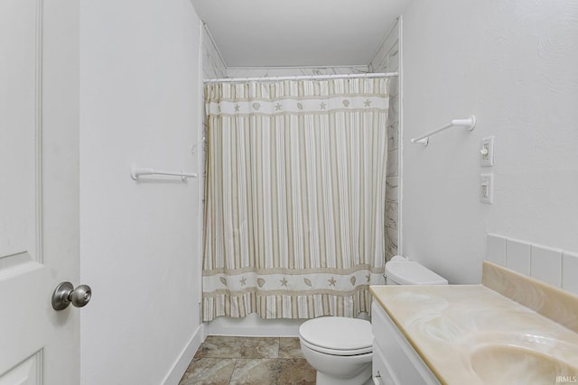 full bathroom featuring vanity and toilet