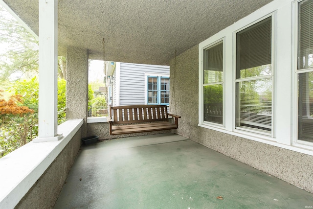 balcony featuring a porch