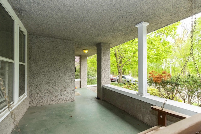 view of patio featuring a porch
