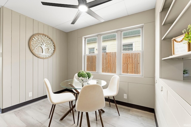 dining area featuring light wood-style floors and a ceiling fan