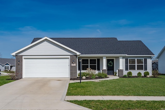 view of front of home featuring driveway, a front yard, a garage, brick siding, and a shingled roof