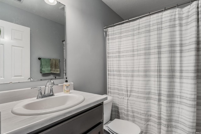 full bathroom with vanity and toilet
