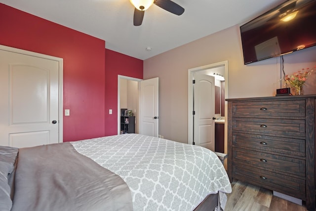 202 Jeremy Dr, Milford, IN 46542 - bedroom with ensuite bath, ceiling fan, and wood finished floors