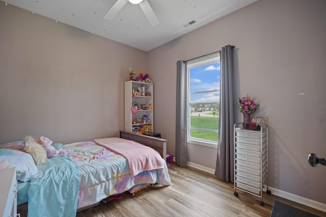 202 Jeremy Dr, Milford, IN 46542 - bedroom with a ceiling fan, baseboards, visible vents, and light wood finished floors