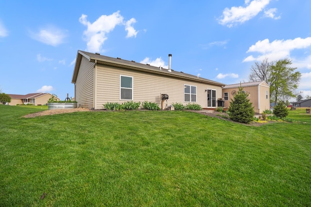 202 Jeremy Dr, Milford, IN 46542 - rear view of house with a lawn