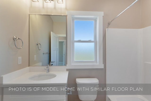 bathroom with vanity and toilet