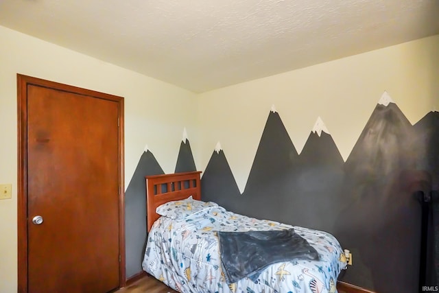 bedroom featuring wood finished floors