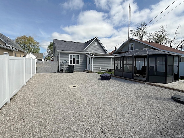 579 E St NE, Linton, IN 47441 - back of property with a sunroom and fence