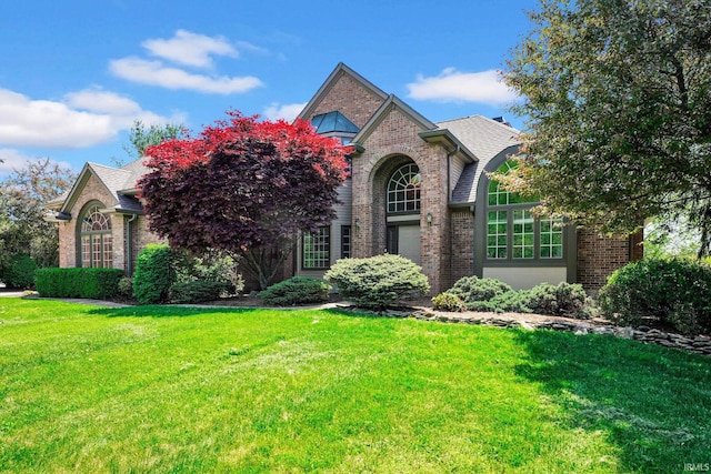 7911 N Thames Dr, Bloomington, IN 47408 - view of front of house with a front lawn and brick siding