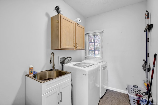 7911 N Thames Dr, Bloomington, IN 47408 - laundry area featuring independent washer and dryer, cabinet space, a sink, carpet floors, and baseboards