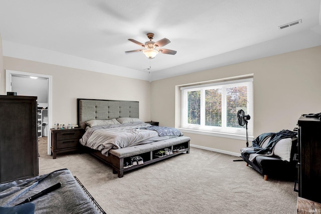 7911 N Thames Dr, Bloomington, IN 47408 - bedroom with baseboards, visible vents, light carpet, and ceiling fan