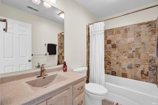 7911 N Thames Dr, Bloomington, IN 47408 - full bath featuring toilet, visible vents, shower / bath combo, and vanity
