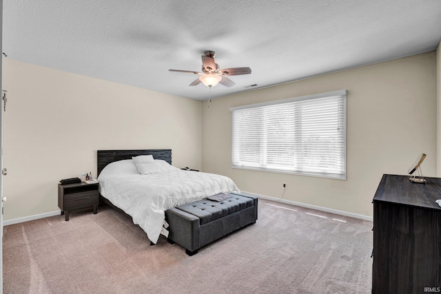 7911 N Thames Dr, Bloomington, IN 47408 - carpeted bedroom featuring baseboards, ceiling fan, a textured ceiling, and visible vents