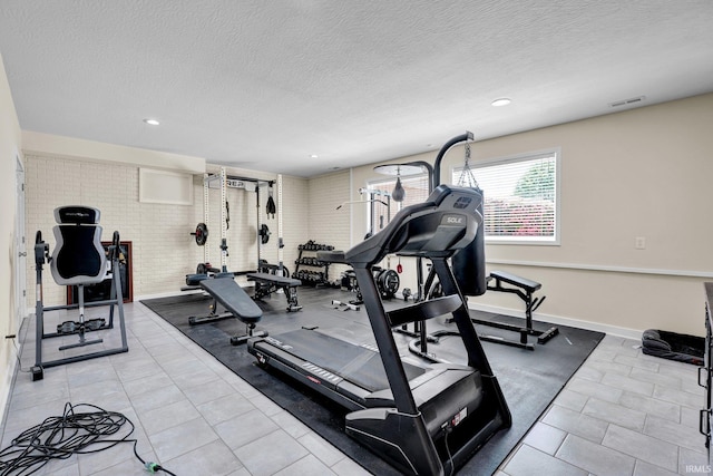 7911 N Thames Dr, Bloomington, IN 47408 - workout area featuring light tile patterned floors, recessed lighting, a textured ceiling, and visible vents