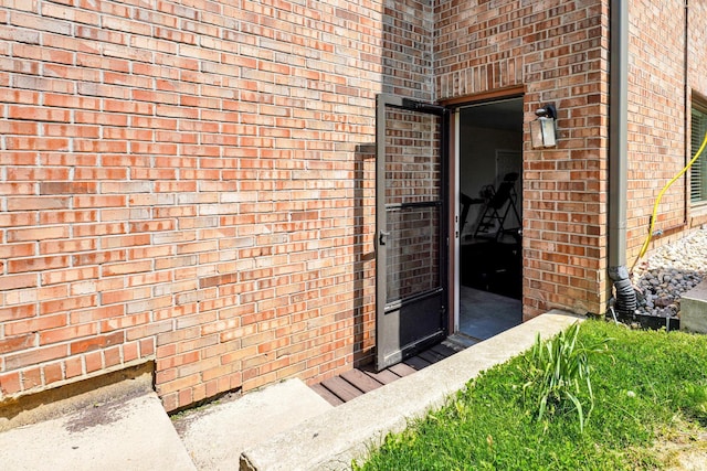 7911 N Thames Dr, Bloomington, IN 47408 - doorway to property featuring brick siding