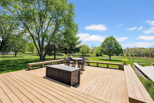 7911 N Thames Dr, Bloomington, IN 47408 - wooden terrace featuring a yard, a fenced backyard, and outdoor dining space