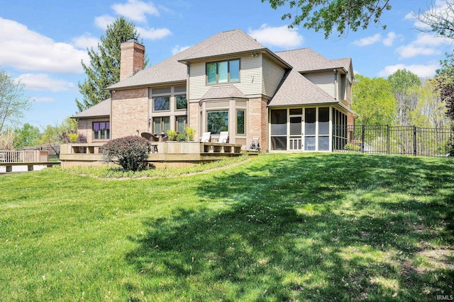 7911 N Thames Dr, Bloomington, IN 47408 - back of house with a sunroom, a fenced backyard, a yard, and a chimney