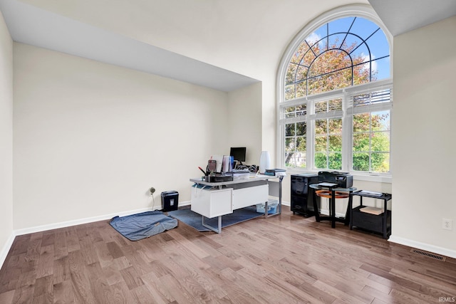 7911 N Thames Dr, Bloomington, IN 47408 - home office featuring baseboards, visible vents, plenty of natural light, and wood finished floors