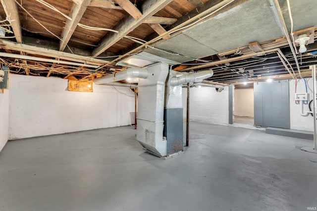 unfinished below grade area featuring heating unit