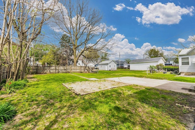 view of yard with fence and a residential view