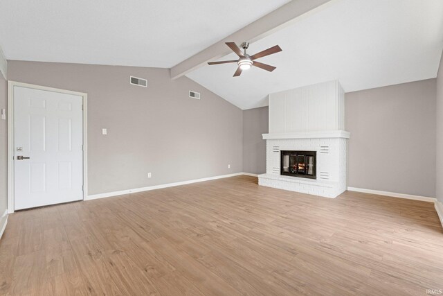 unfurnished living room with visible vents, ceiling fan, and light wood-type flooring