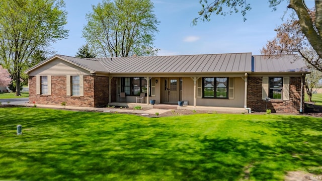 3678 W 200 N, Wabash, IN 46992 - back of house featuring a porch, a lawn, and metal roof