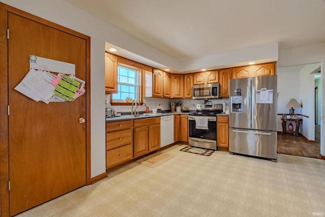3678 W 200 N, Wabash, IN 46992 - kitchen featuring a sink, light floors, brown cabinetry, and stainless steel appliances