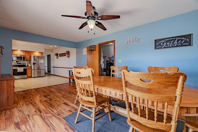 3678 W 200 N, Wabash, IN 46992 - dining area featuring baseboards, light wood-style flooring, and ceiling fan